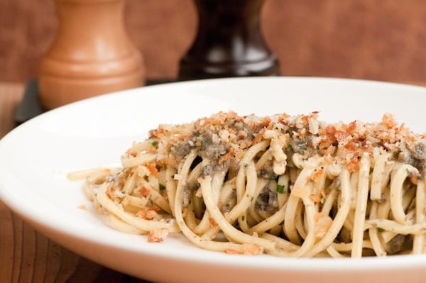 Housemade Chitarra, Wild Burgundy Snail Bolognese, Soft Herbs, and Crunchy Crumb Topping